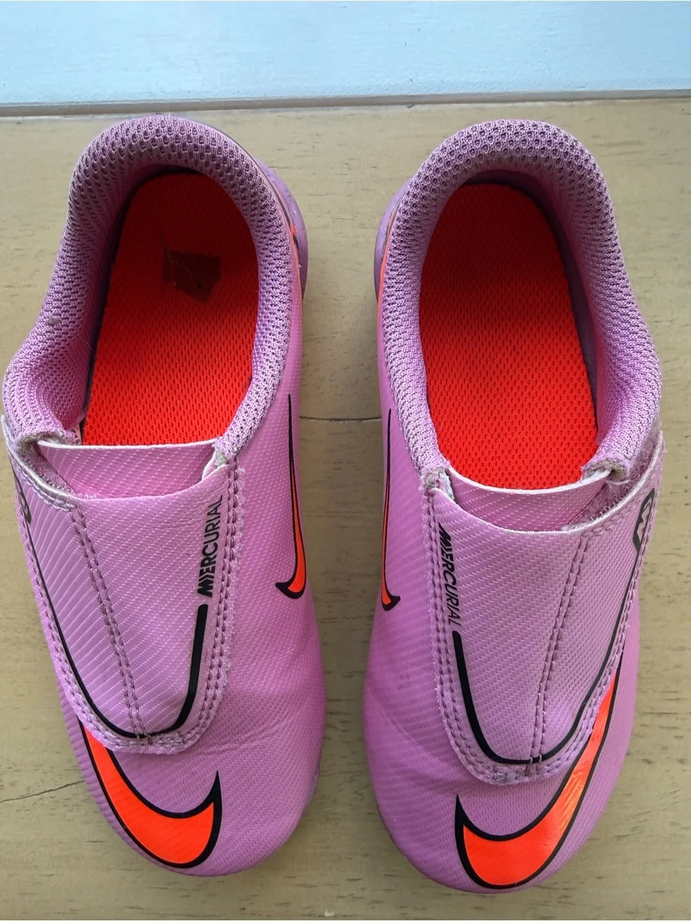 Nike Mercurial Kids Pink Soccer Cleats with Orange and Black Accents